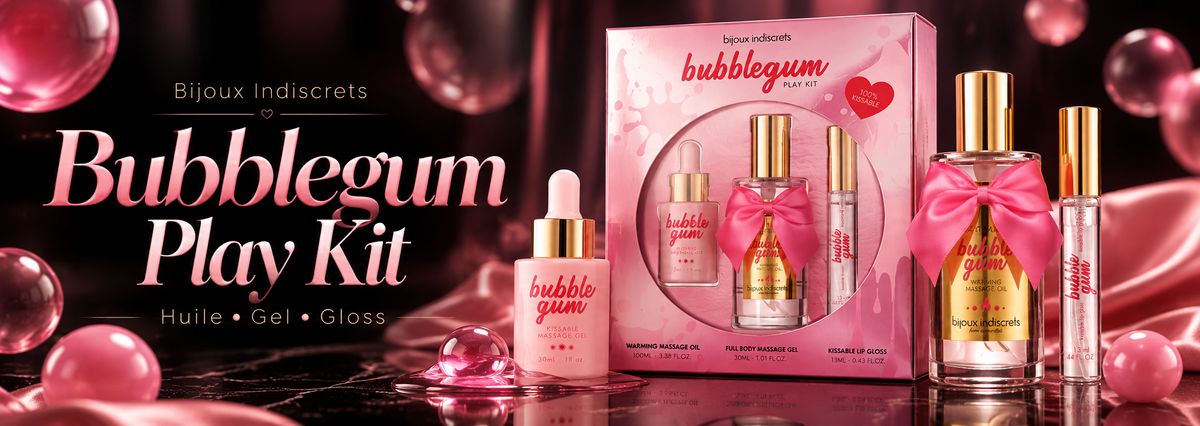 Bannière du coffret Bubblegum Play Kit de Bijoux Indiscrets, présentant une huile de massage chauffante, un gel de massage et un brillant à lèvres, dans une ambiance luxueuse noire et rose aux reflets dorés.